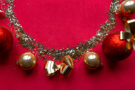 Golden frame and Christmas decoration on red background, copy space for the text. Merry Christmas and Happy New yearの写真素材