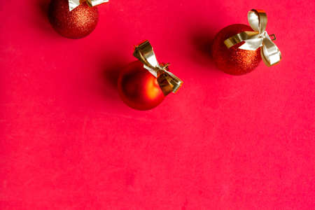 Golden Christmas decorations on red background. Merry Christmas and Happy New Yearの写真素材
