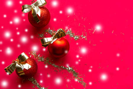 Golden Christmas decorations on red background. Merry Christmas and Happy New Yearの写真素材