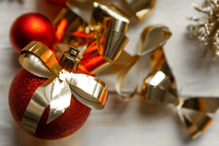 Red Christmas baubles with golden bows, closeupの写真素材