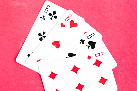 Poker quads playing card, red background