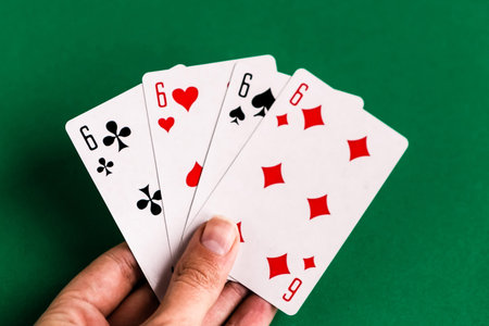 Poker quads playing card, green background