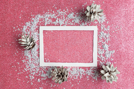 Christmas photo frame on pink glitter background. Template for Christmas greeting cardの写真素材