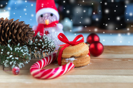 Christmas composition with candy cane and Christmas tree branches at wooden backround, top view, copy spaceの写真素材
