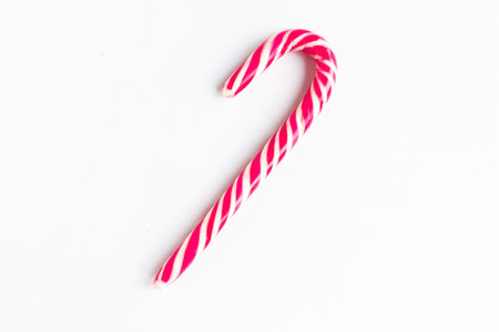 Christmas candy cane isolated at white background, top viewの写真素材