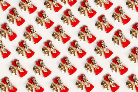 Christmas pattern with golden christmas bells on white background. Festive Christmas backgroundの写真素材