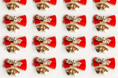 Christmas pattern with golden christmas bells on white background. Festive Christmas background
