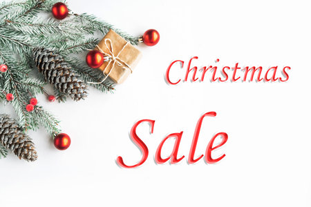 Christmas sale concept with Christmas tree and gift box on white background, top viewの写真素材