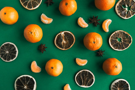 Tangerine pattern on green background. Christmas festive background.
