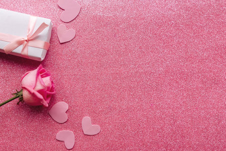 Rose and gift box on glitter background, top view. Valentine's Day greeting cardの写真素材