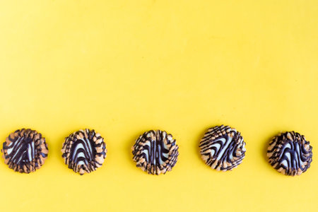 Cookie frame on bright yellow background, copy space for the textの写真素材