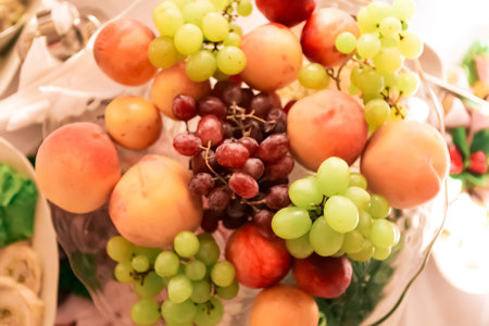 Plate with raw mixed fruits, top view