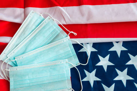 Protective surgical face mask on American national flag.の写真素材
