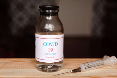Coronavirus vaccine bottles and syringe injection. Prevention and treatment from corona virus infection. Medicine infectious concept.の写真素材