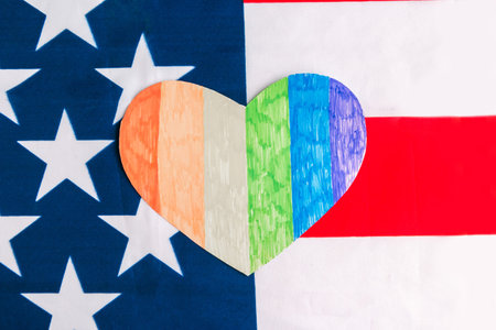 Heart in lgbt colors and flag of United States of America. Equality sex conceptの写真素材