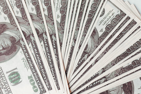 Fan of hundred dollars, top view. USA dollars background