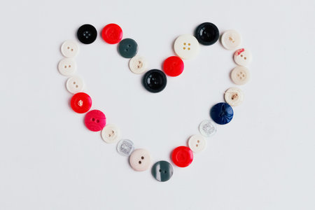 Valentine heart of color old buttons on white backgroundの写真素材