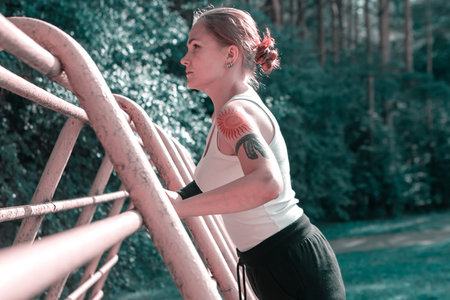 Young woman doing training in the forest. Outdoor sport activity concept