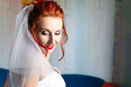 Portrait of young bride in wedding dress and veil, close upの写真素材