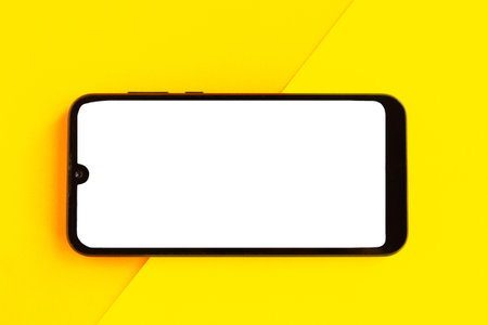 Mobile phone with white mockup screen on color geometric background.