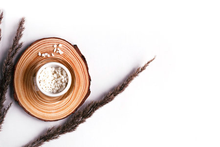 Natural cosmetic salt in jar and herbs. Organic cosmetic product concept. Copy space for the text