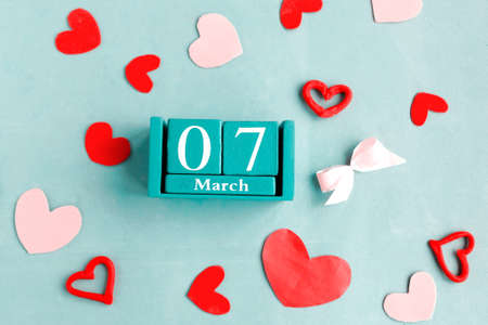 March 7. Blue cube calendar with month date on blue pastel background.の写真素材