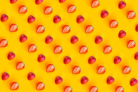 Strawberry pattern on bright orange background. minimal conceptの写真素材