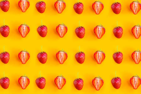 Strawberry pattern on bright orange background. minimal conceptの写真素材