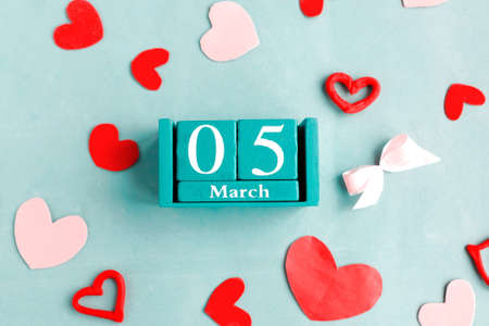 March 5. Blue cube calendar with month date on blue pastel background.の写真素材