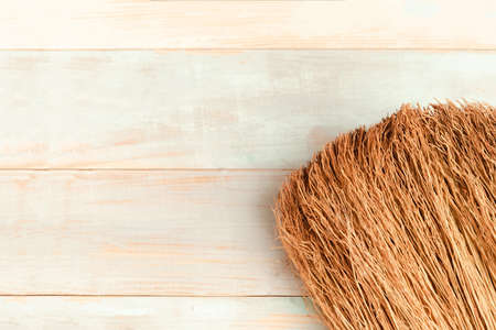 Broom on wooden background. Spring cleaning concept. copy spaceの写真素材