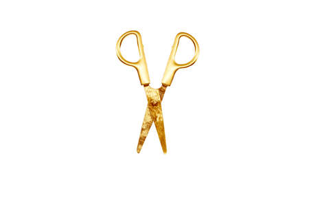 Golden scissors isolated on whiteの写真素材