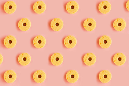 Seamless pattern of yellow sponges for washing dishes on pink background. minimal concept. Copy space for your textの写真素材