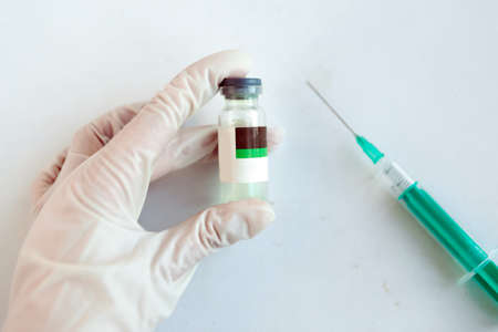 Close up photo of doctor hand with medicine bottleの写真素材