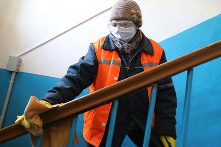 Minsk Belarus â March 27 2020: Disinfection during the coronavirus pandemic. Professional hygienic treatment of residential buildingsのeditorial素材
