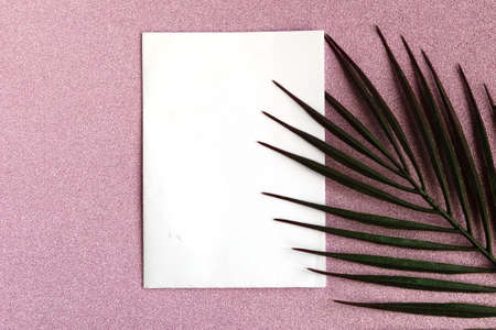 White mockup blank and palm tree branches on pink glitter background. minimal concept. copy spaceの写真素材