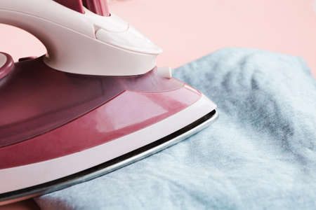 Pink iron and gray t-shirt. Close upの写真素材