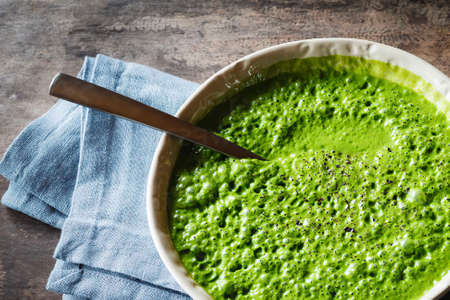 Bowl of vegan cocos spinach soupの写真素材