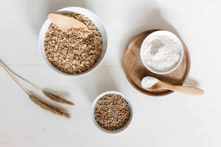 various types of cereals in bowls on the tableの写真素材