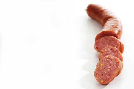 Sliced salami isolated on white, copy spaceの写真素材