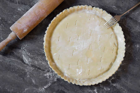 Cake pan with raw short crust, top viewの写真素材