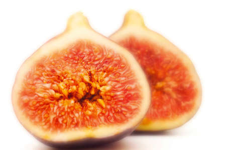 Sliced figs isolated on white background, close-upの写真素材