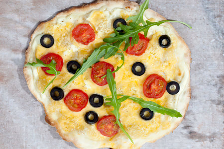 Fresh tasty homemade pizza isolated on table, top viewの写真素材