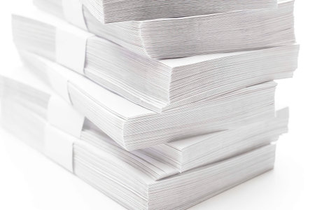 Stacks of clean empty envelopes on white background