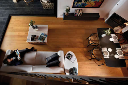 Luxury living room, dining room, and kitchen interior, view from aboveの写真素材