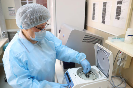 Minsk Belarus â February 10 2021: doctor in the lab explores a coronavirus testのeditorial素材