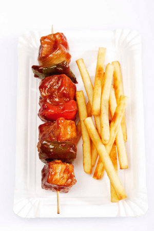 meat skewer with french friesの写真素材
