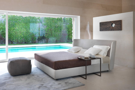 Luxury bedroom with swimming pool, view from the terraceの写真素材