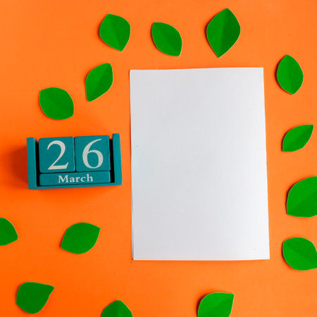 March 26. blue cube calendar and white mockup blank on bright orange backgroundの写真素材