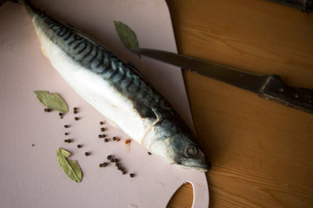 salted mackerel on the chopping board, top viewの写真素材