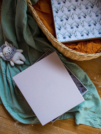 Notebook with a white sheet of paper in a wicker basketの写真素材
